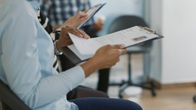 female-candidate-sitting-queue-receiving-cv-files-waiting-start-job-interview-about-career-opportunity-woman-getting-ready-attend-recruitment-meeting-with-hr-employee