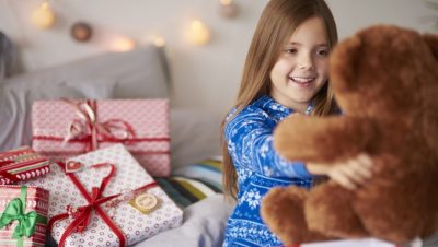 Happy girl with ideal Christmas present